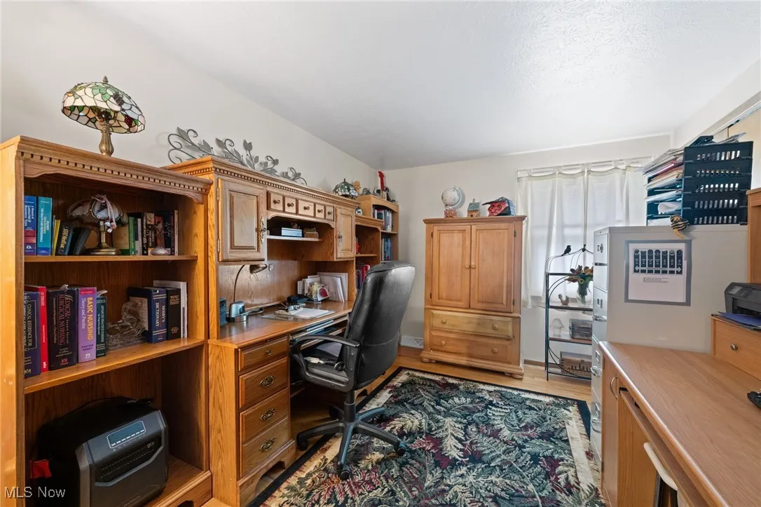 Office area with light wood-style floors