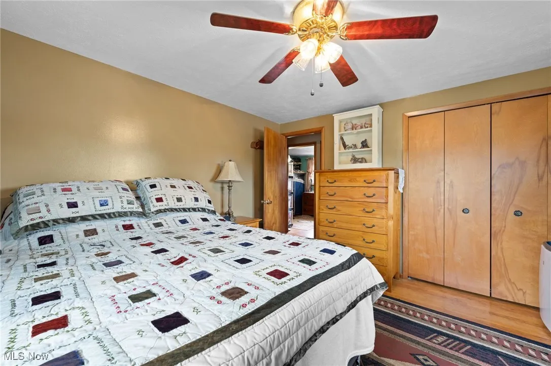 Bedroom featuring a closet and a ceiling fan