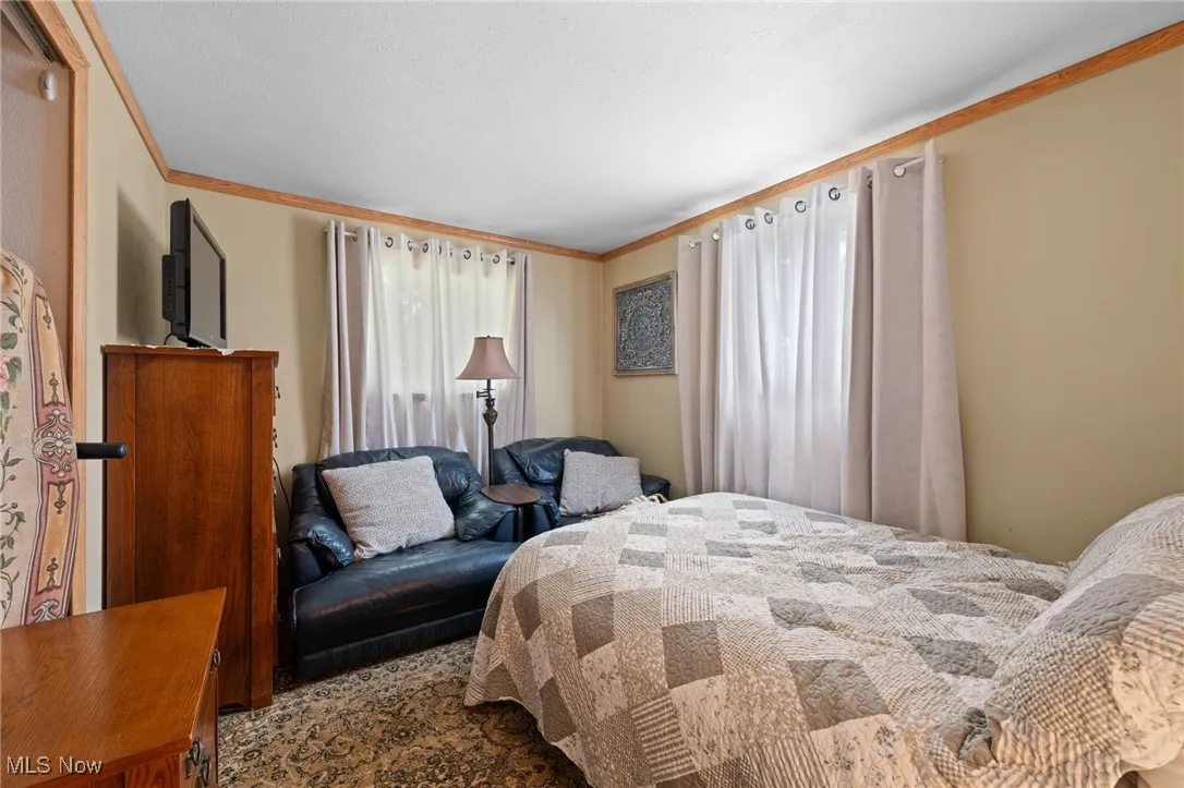 Bedroom featuring ornamental molding