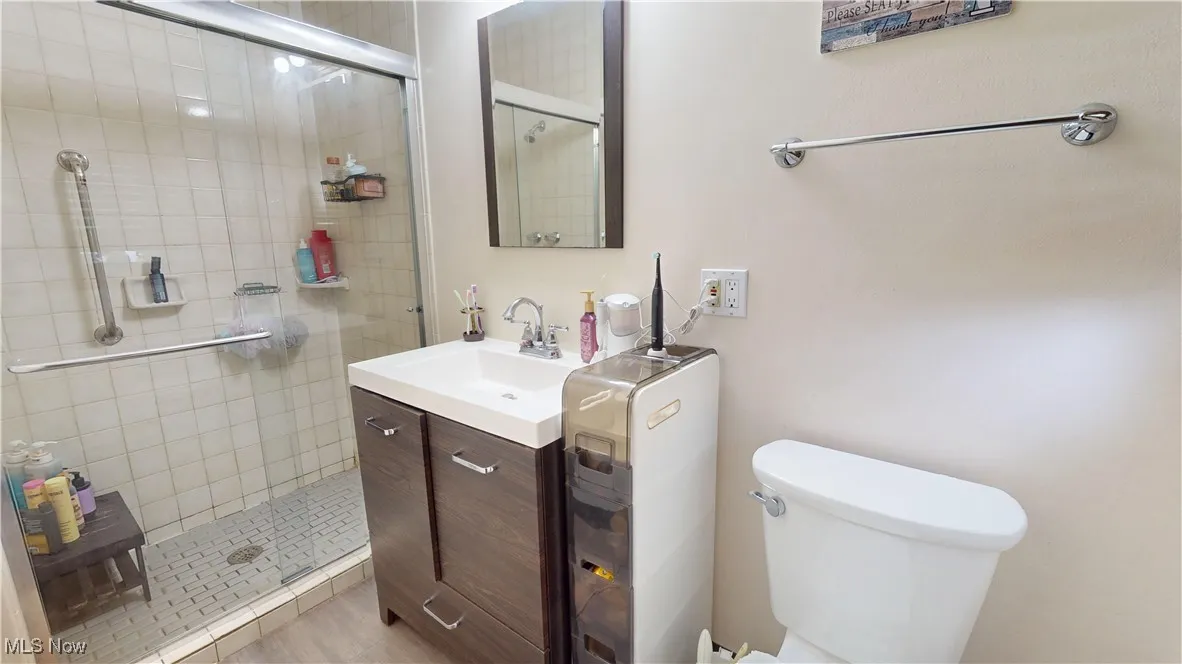 Master Bathroom with vanity and a shower stall