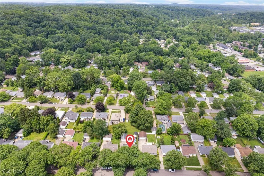 Aerial view of residential area with a forest