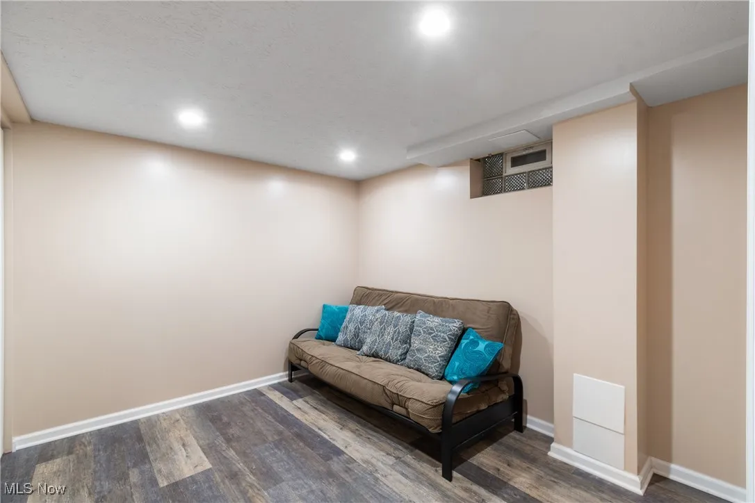 Sitting room featuring wood finished floors and recessed lighting