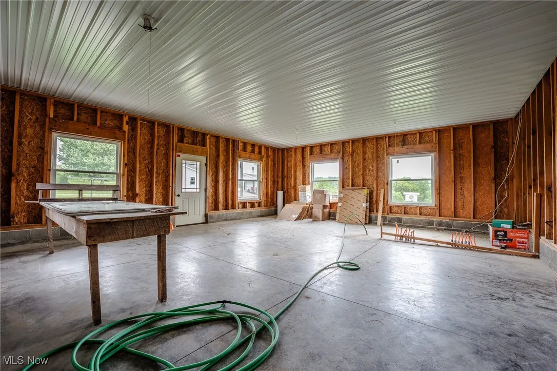 Miscellaneous room featuring concrete flooring