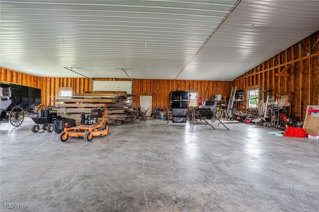Garage featuring wood walls