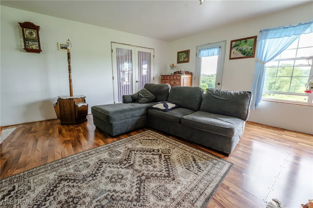 Living room with healthy amount of natural light and wood finished floors