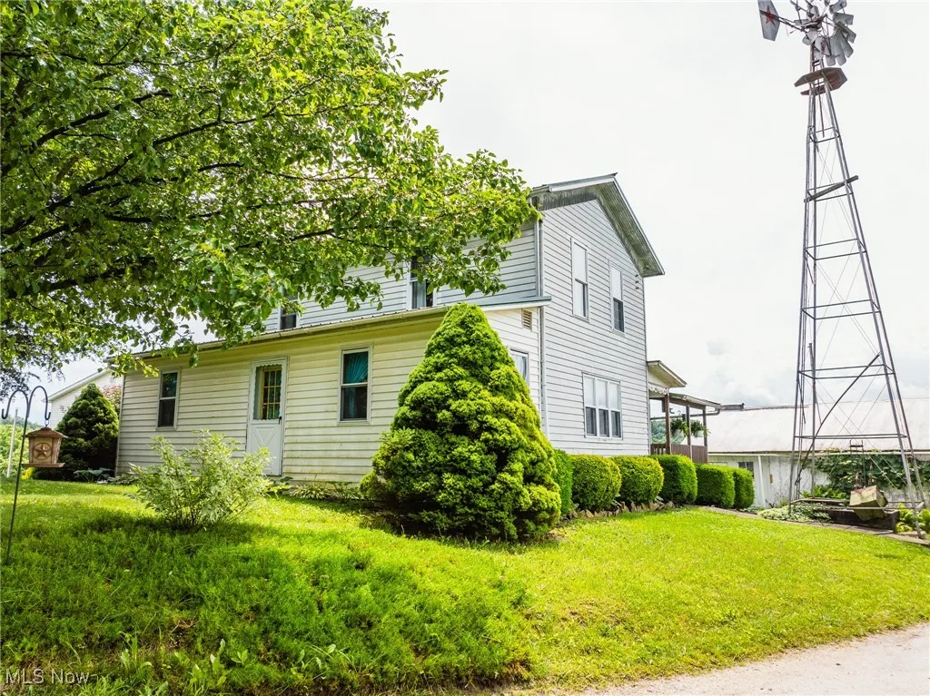 View of home's exterior with a lawn