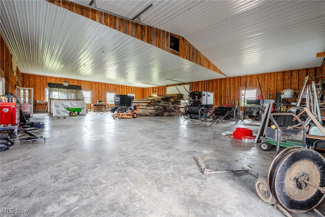 Garage featuring wooden walls