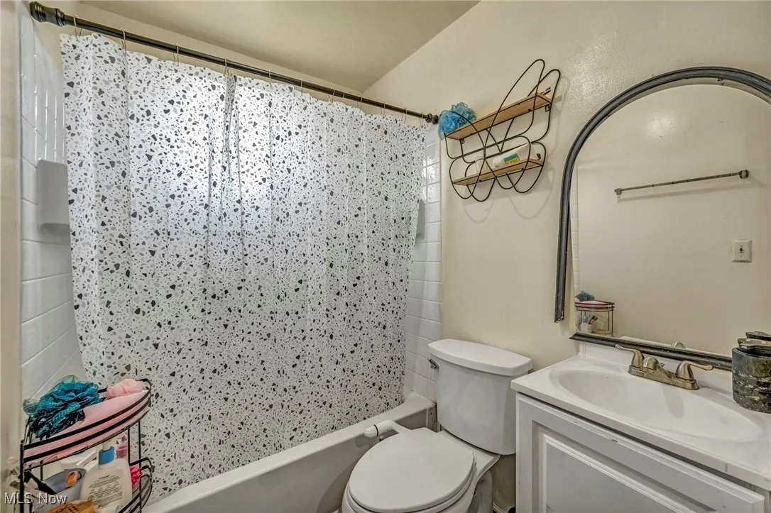 Full bath with vanity and shower / bathtub combination with curtain