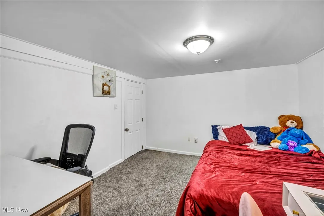 Bedroom with carpet and baseboards