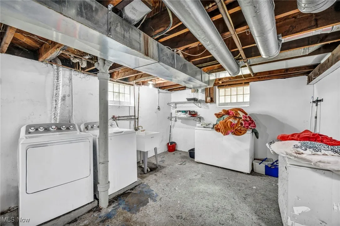 Below grade area with washing machine and dryer and plenty of natural light
