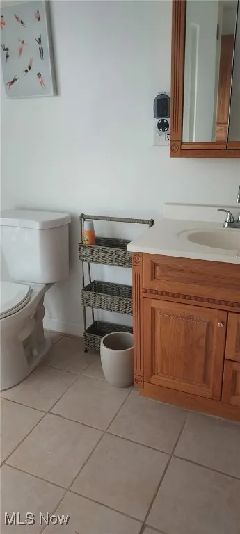Bathroom featuring vanity and tile patterned floors