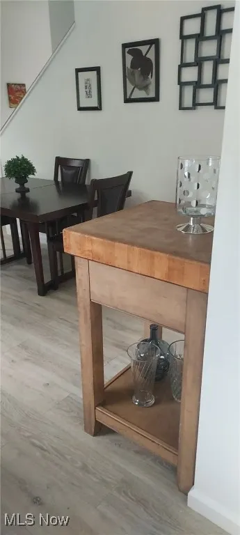 Detailed view of wood finished floors and baseboards