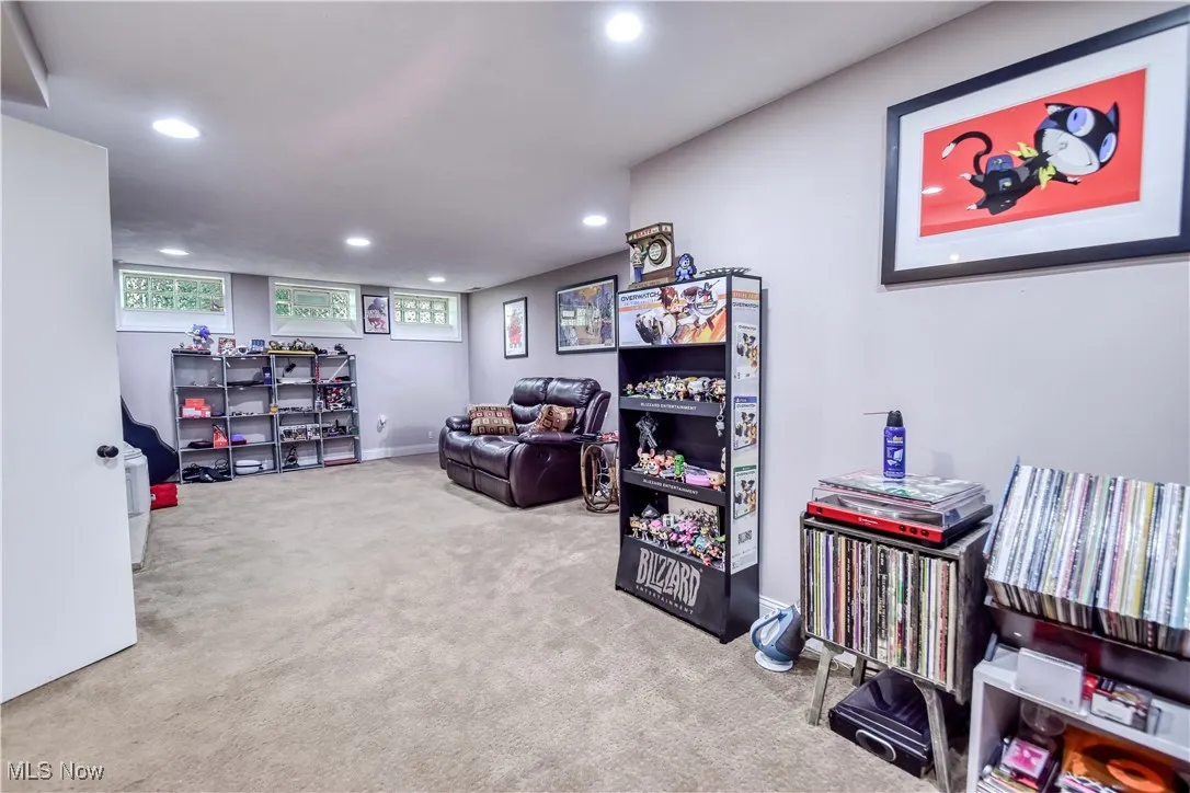 Living area featuring recessed lighting and carpet