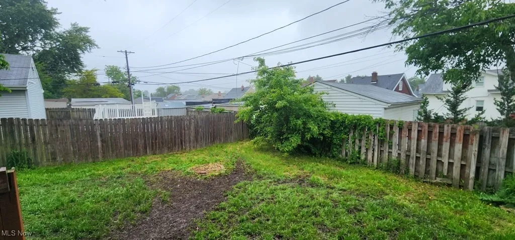 View of fenced backyard
