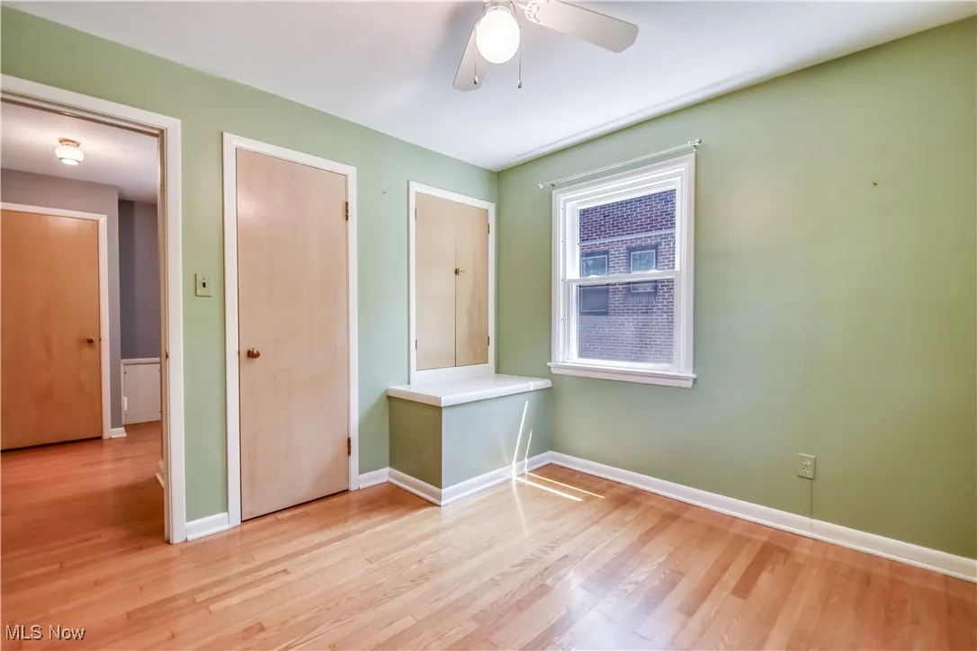 Unfurnished room featuring light wood-style flooring and a ceiling fan