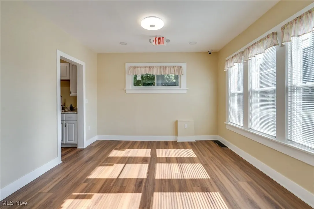 Empty room with wood finished floors and baseboards