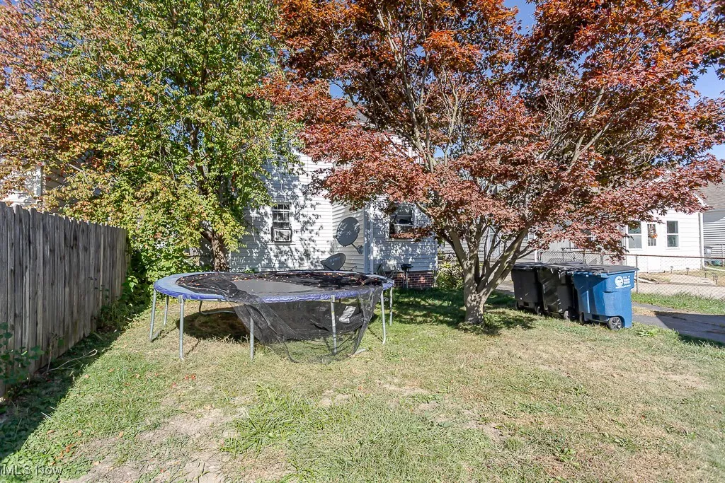 View of yard featuring a trampoline