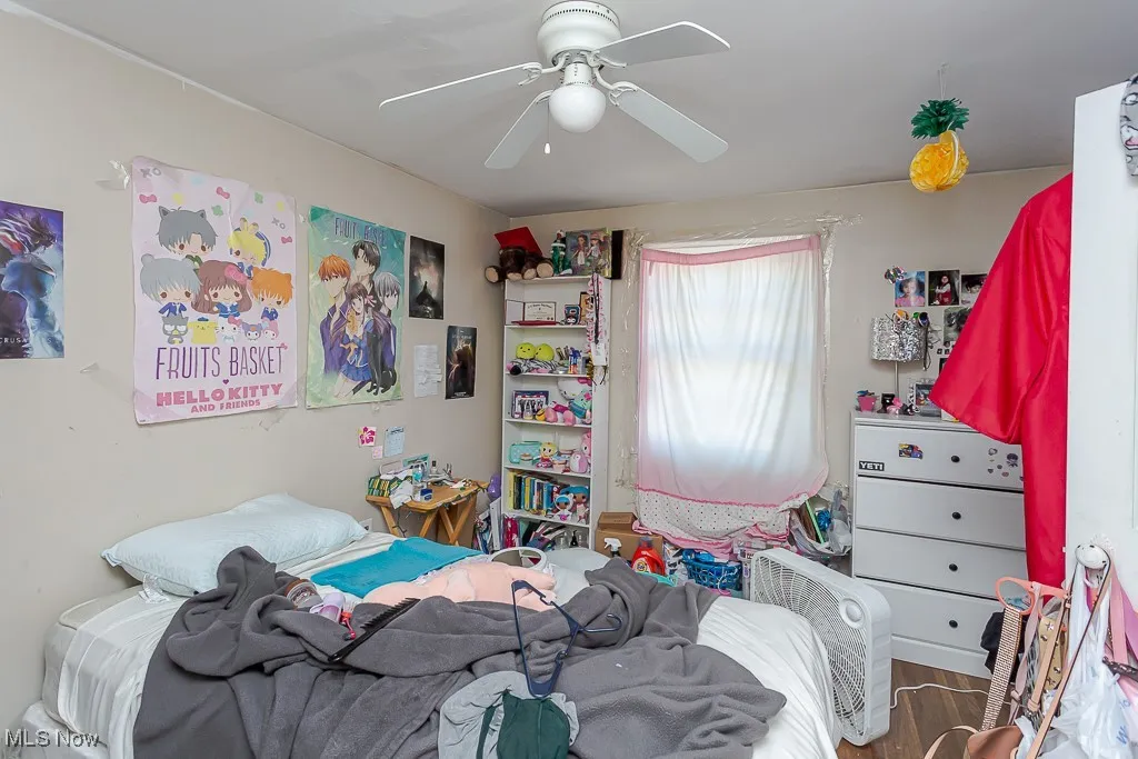 Bedroom featuring a ceiling fan and wood finished floors