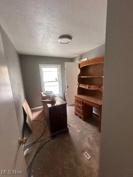 Office with a textured ceiling