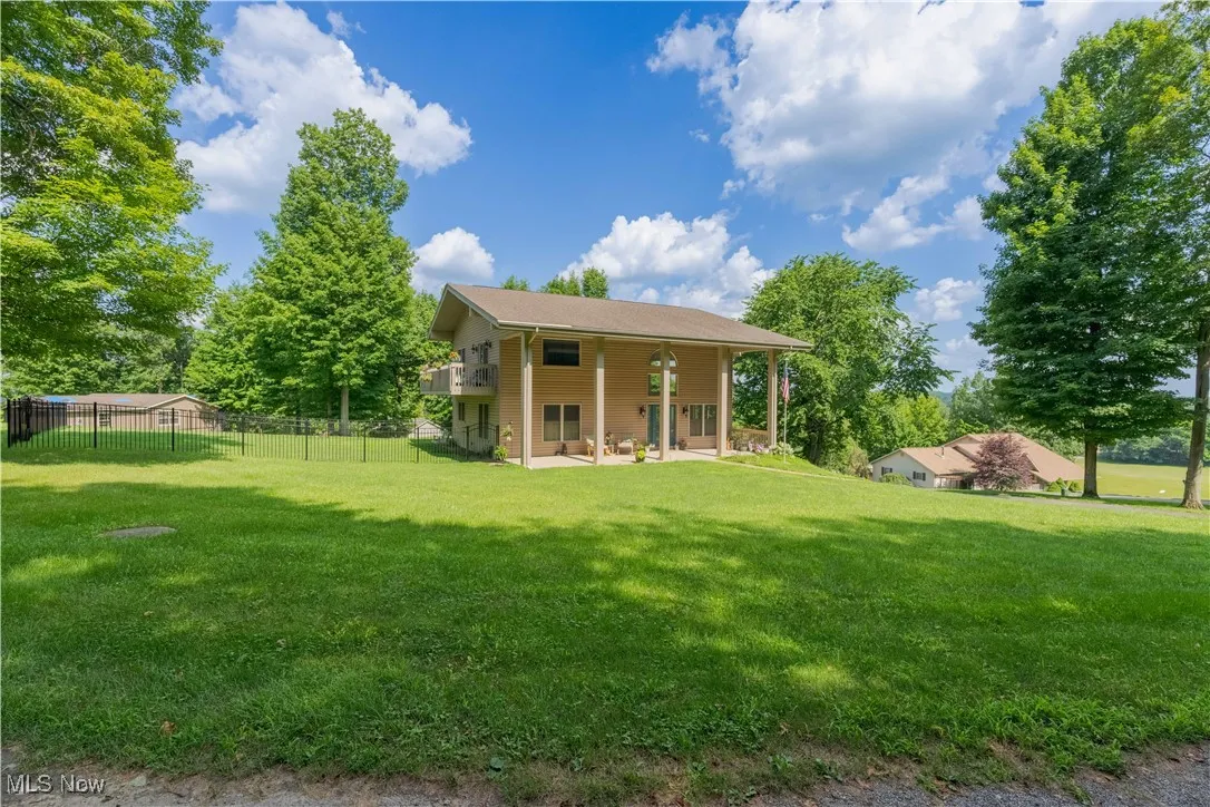 Rear view of property with a patio area