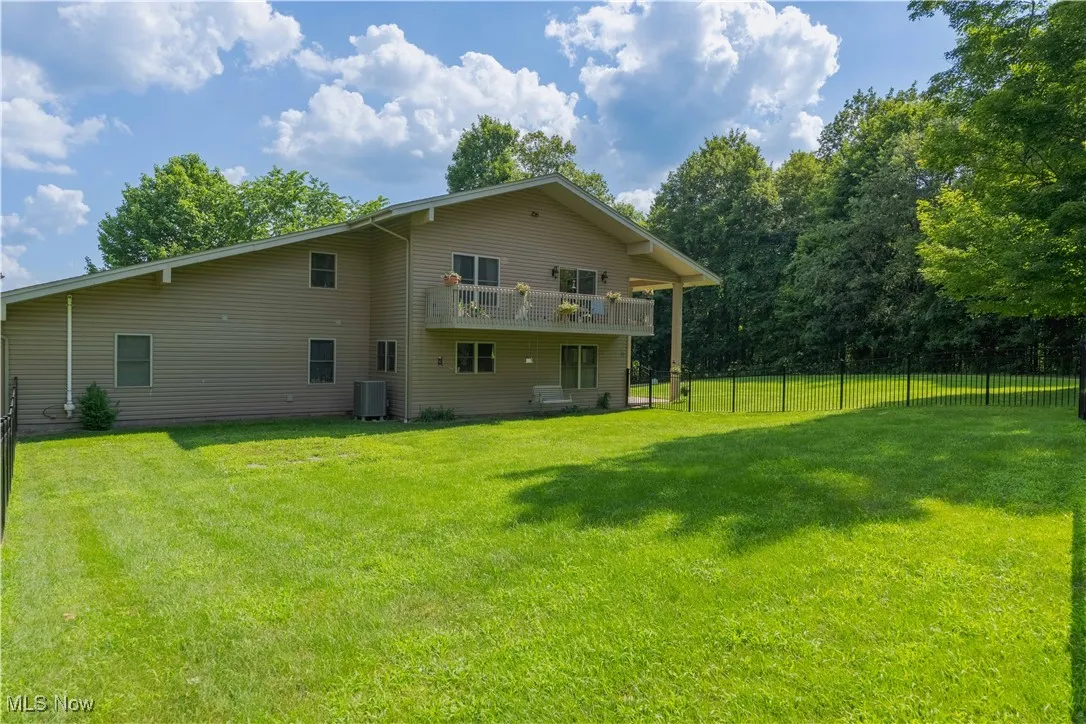 Rear view of property featuring a balcony