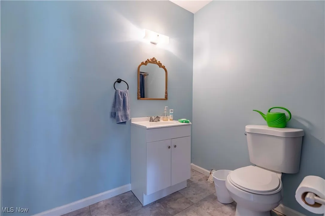 Bathroom with baseboards and vanity