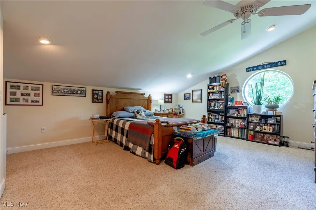 Bedroom with carpet, vaulted ceiling, recessed lighting, and a ceiling fan