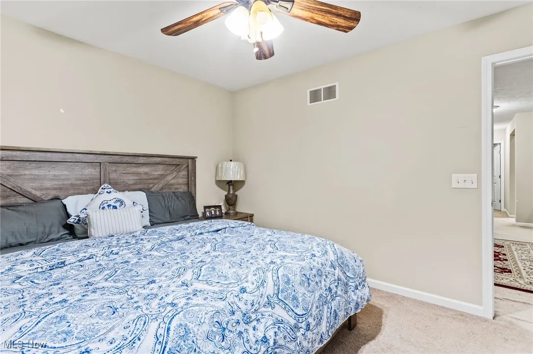 Bedroom featuring carpet flooring and ceiling fan