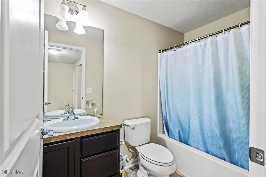 Full bathroom with vanity and shower / bath combo