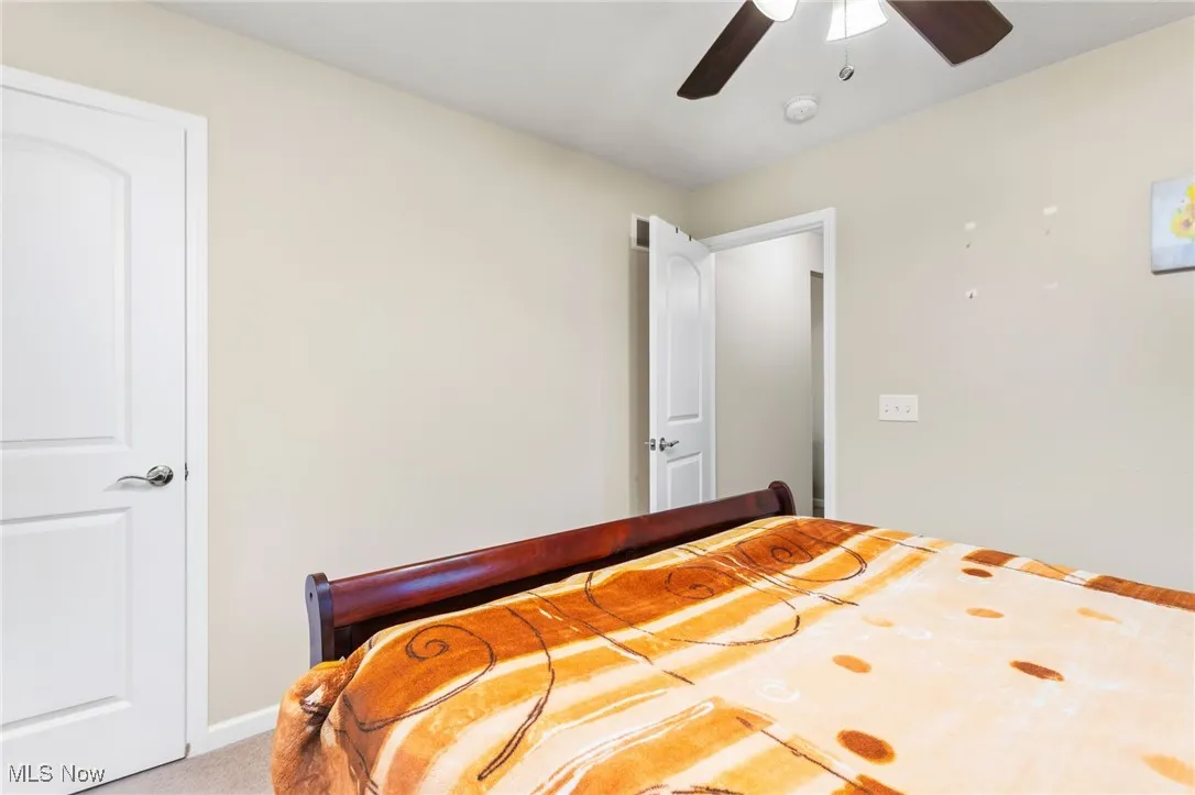Bedroom with carpet floors and ceiling fan