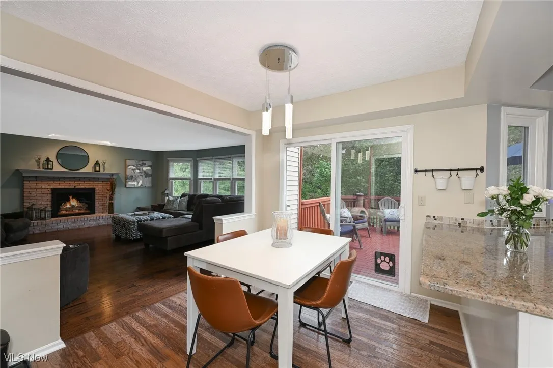 Kitchen dining area - open to Family Room (fireplace in family room digitally enhanced)