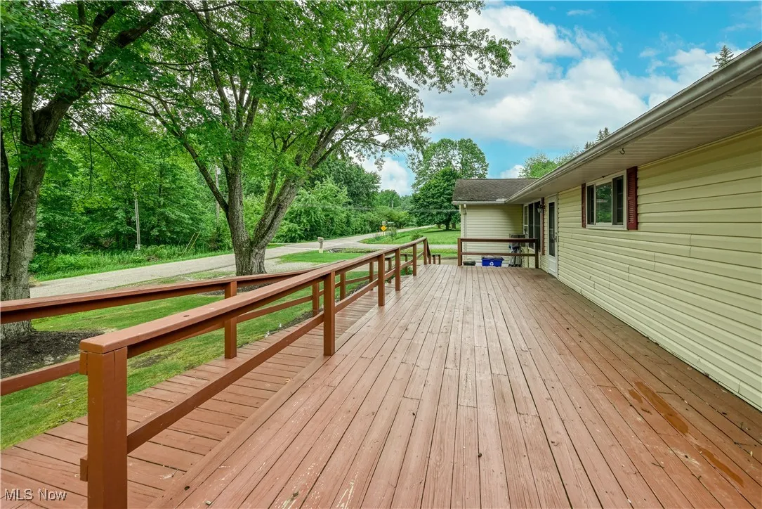 Wooden terrace with a lawn