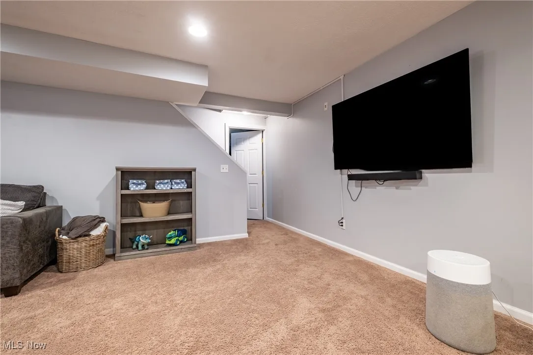 Finished below grade area featuring carpet flooring