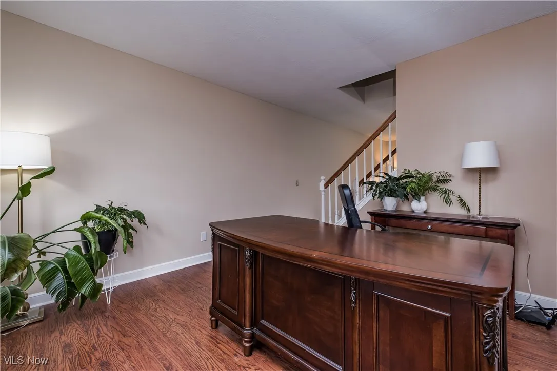 Office area with wood finished floors and baseboards