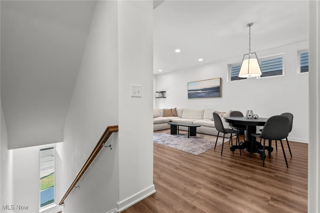 Living room with wood finished floors and recessed lighting