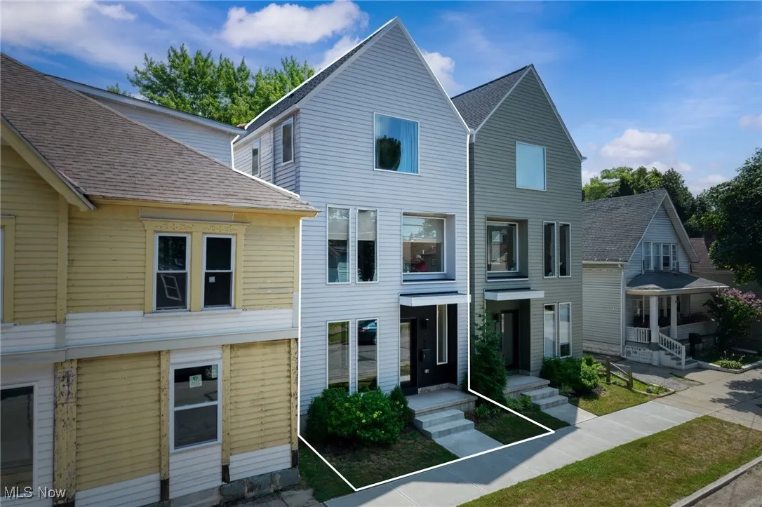 Multi unit property featuring roof with shingles