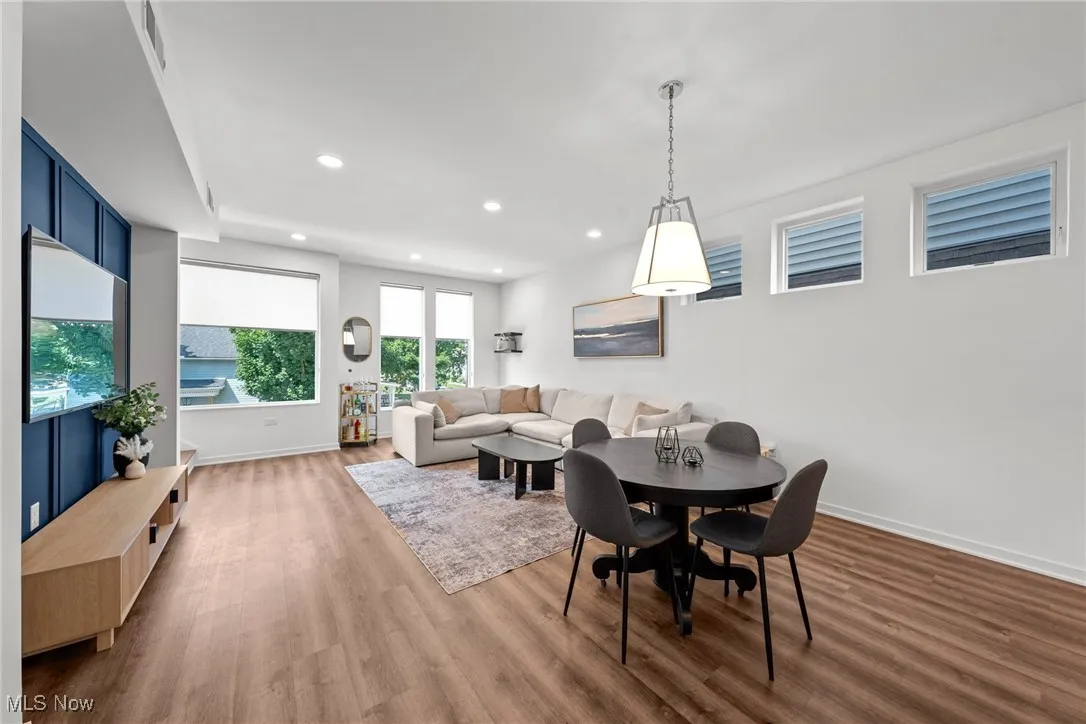 Dining area featuring wood finished floors and recessed lighting
