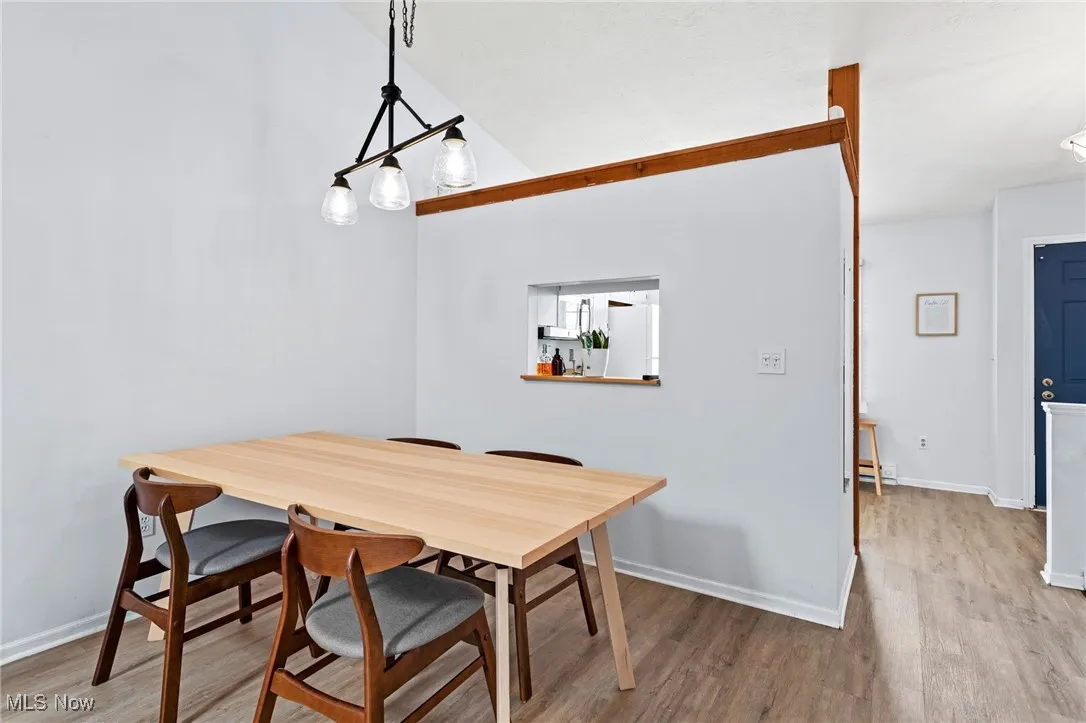 Dining room with wood finished floors and baseboards