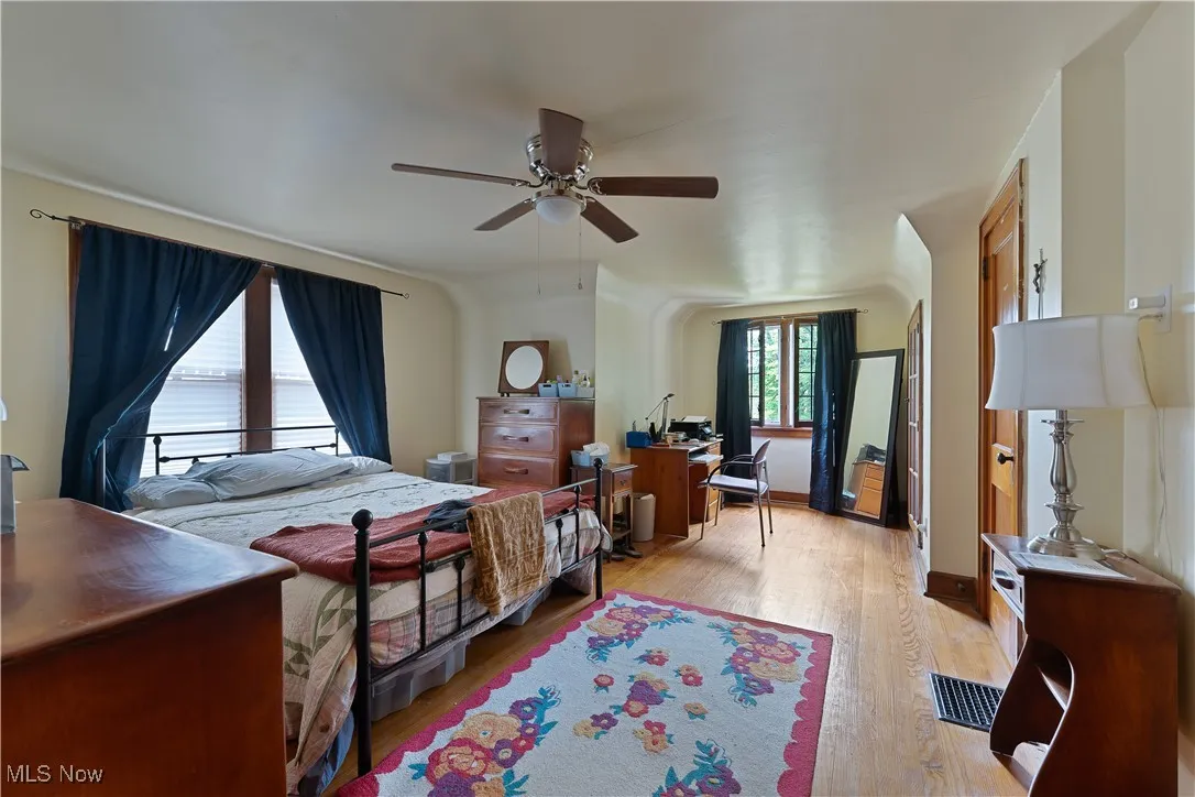 Bedroom with light wood-style flooring and ceiling fan