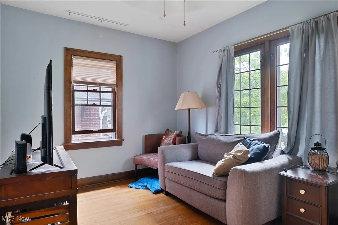 Living area featuring light wood-type flooring and baseboards