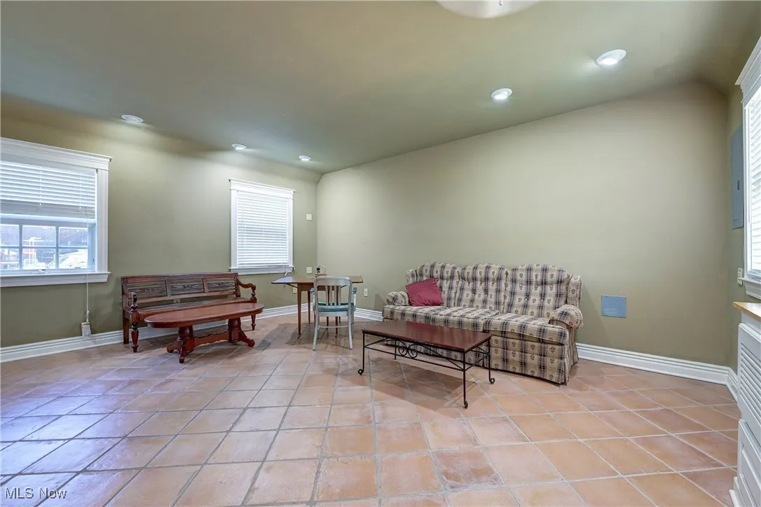 Sitting room featuring recessed lighting and light tile patterned floors