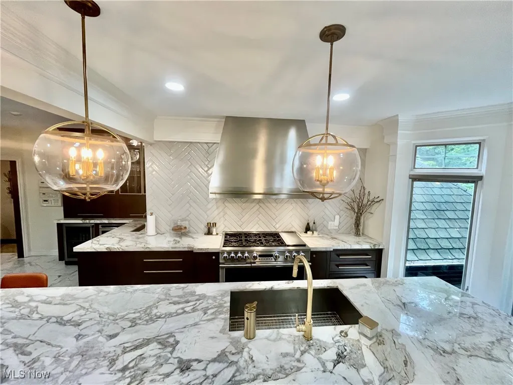 If you noticed the hood fan is a commercial grade that covers more than the surface area of the stove so no matter what burner you’re using it will draw!