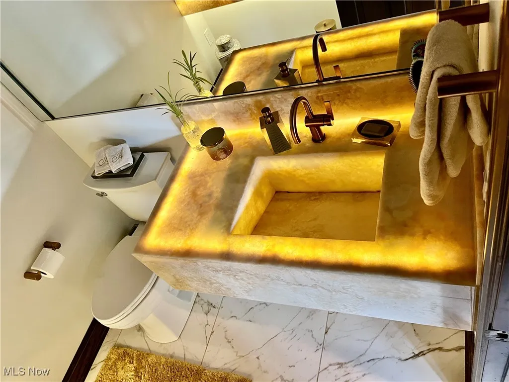 This half bath has special built-in lighting unlike no other