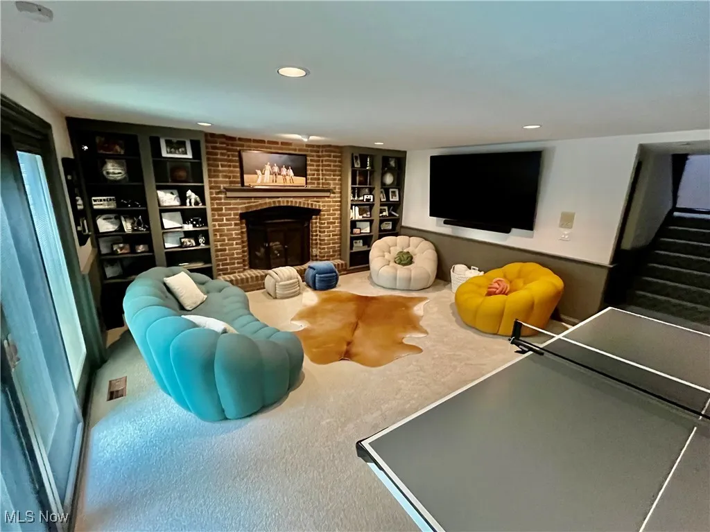Game and family area complete with a wet bar walk out to the beautiful backyard. Enjoy the built-in covered pool.