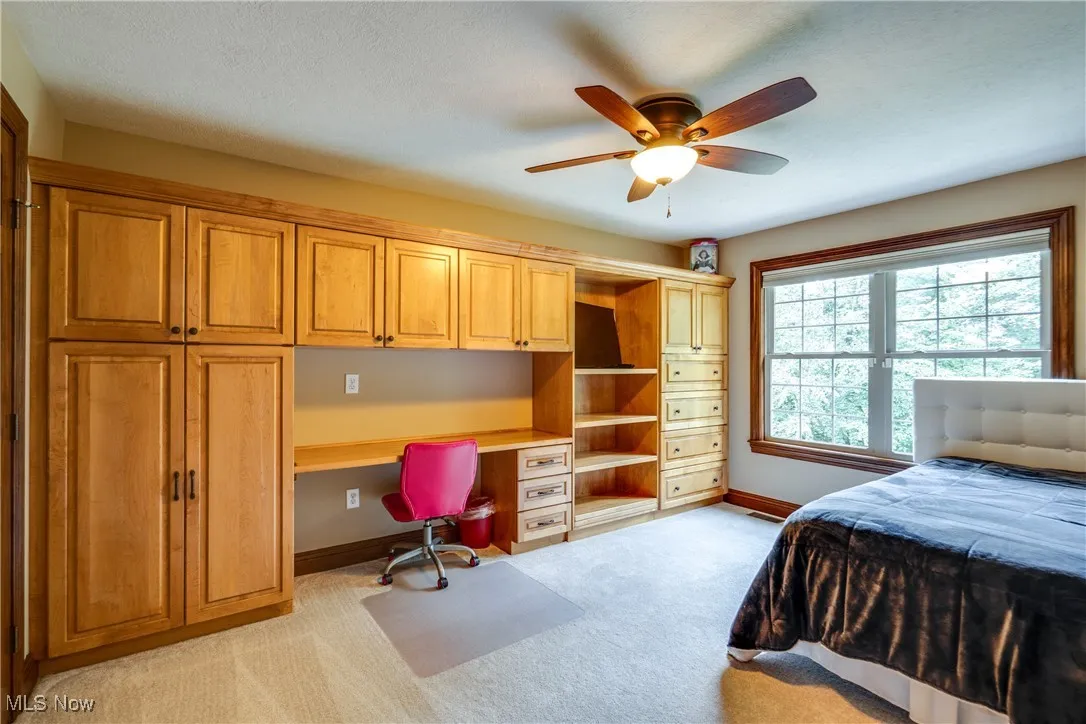 Upper level bedroom with built ins
