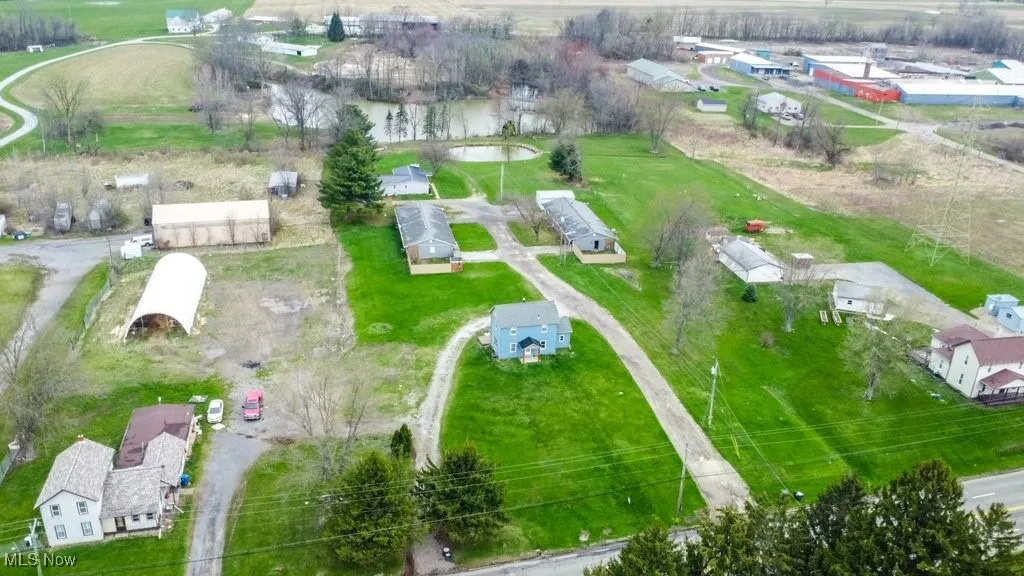 Birds eye view of property with a residential view
