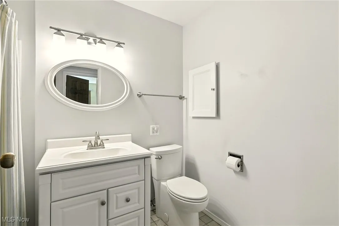 Bathroom with vanity and tile patterned floors