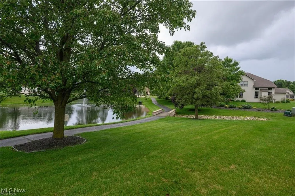 View of green lawn with a water view