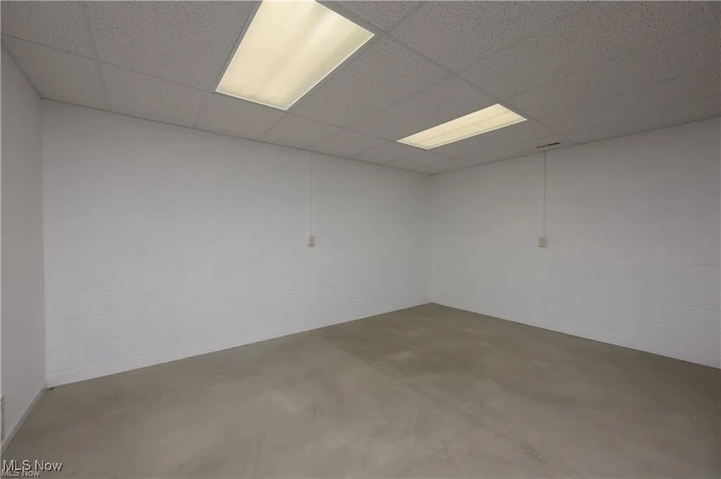 Finished basement with a drop ceiling