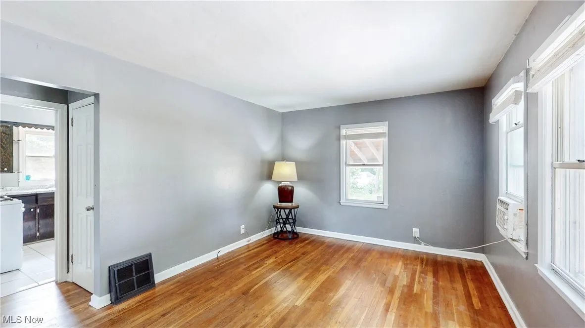 Spare room with light wood-style flooring and cooling unit